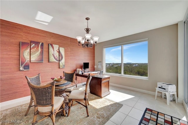 dining room with light tile patterned floors and an inviting chandelier