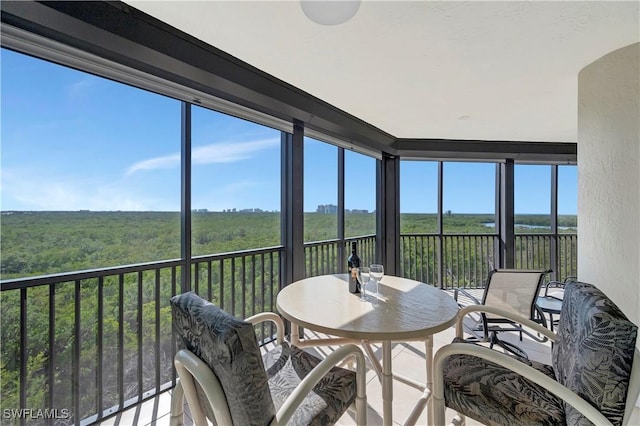 sunroom / solarium featuring a healthy amount of sunlight