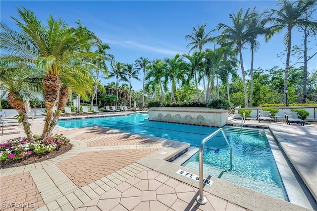 view of pool featuring a patio area