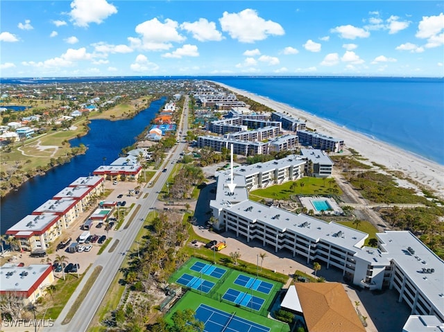 bird's eye view featuring a water view and a view of the beach