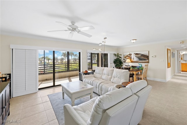 tiled living room with baseboard heating, ceiling fan, and ornamental molding