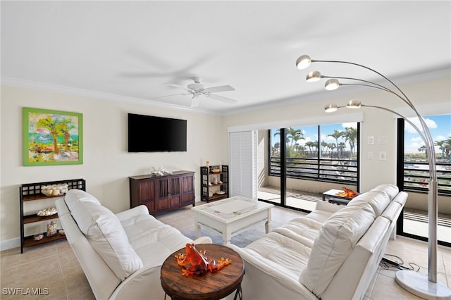 tiled living room with ceiling fan and crown molding