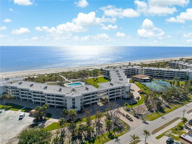 birds eye view of property featuring a view of the beach and a water view