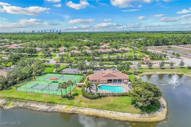 birds eye view of property with a water view