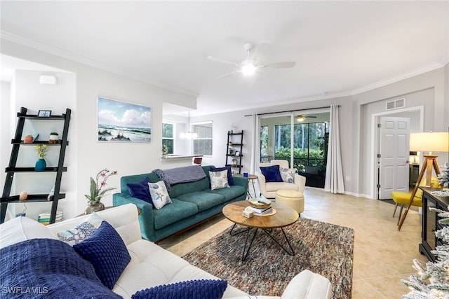 tiled living room with ceiling fan and crown molding