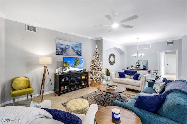 tiled living room featuring ceiling fan with notable chandelier and crown molding