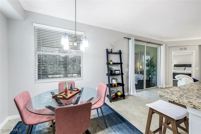 tiled dining area with crown molding