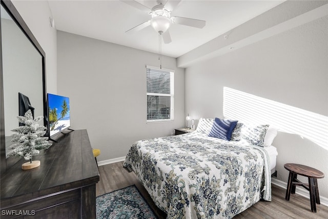 bedroom featuring hardwood / wood-style flooring and ceiling fan