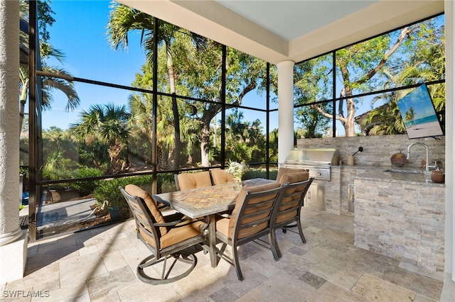 24221 Addison Place Ct, Bonita Springs, FL 34134 - sunroom / solarium with stone tile floors and a sink