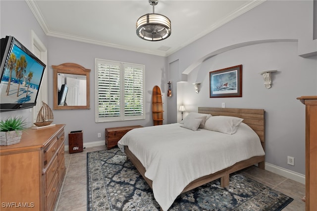 bedroom featuring ornamental molding and light tile patterned floors