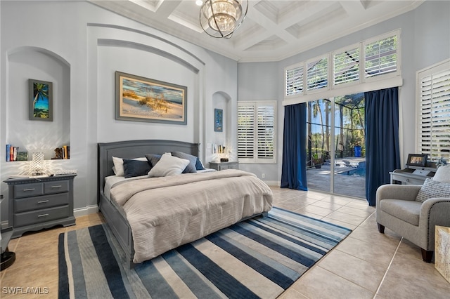 tiled bedroom with a high ceiling, coffered ceiling, crown molding, access to exterior, and a notable chandelier