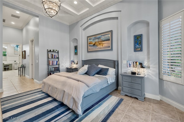 tiled bedroom with crown molding, coffered ceiling, a high ceiling, and an inviting chandelier