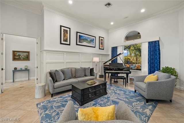 living room with light tile patterned floors and ornamental molding