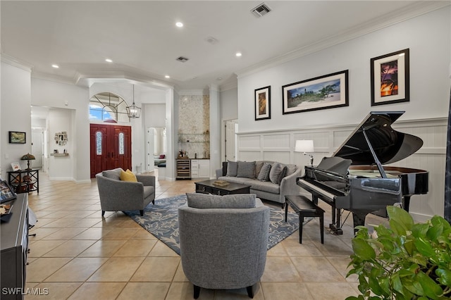 tiled living room featuring a chandelier and ornamental molding