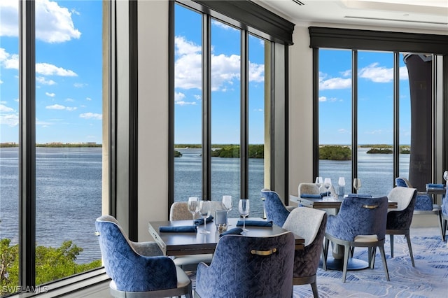 dining room with a water view