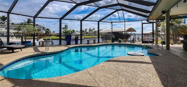 outdoor pool featuring a patio area and glass enclosure