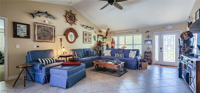 living area featuring light tile patterned floors, visible vents, ceiling fan, and vaulted ceiling