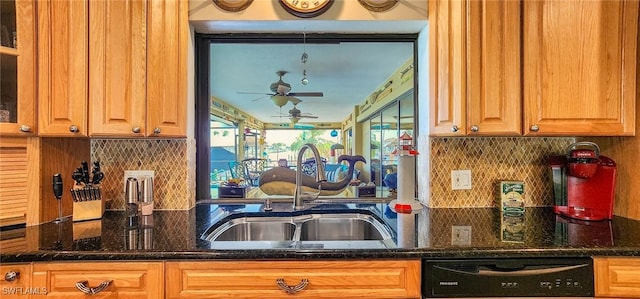 kitchen with a sink, tasteful backsplash, black dishwasher, dark stone counters, and ceiling fan