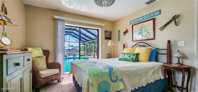 bedroom with access to outside, visible vents, carpet floors, and a sunroom