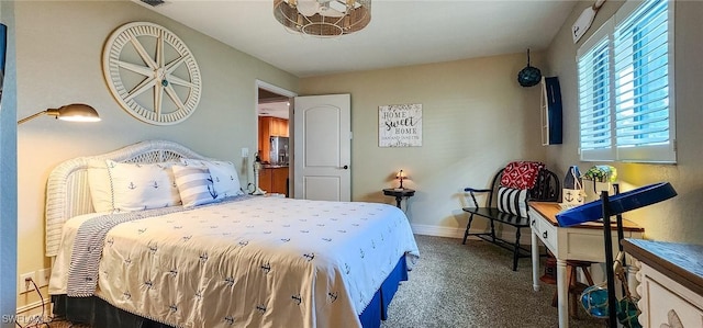 bedroom featuring visible vents, baseboards, and carpet