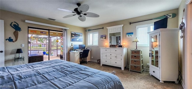 bedroom featuring access to outside, multiple windows, visible vents, and light carpet