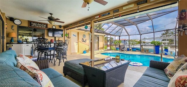 outdoor pool featuring a ceiling fan