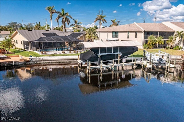 dock area featuring a lanai and a water view