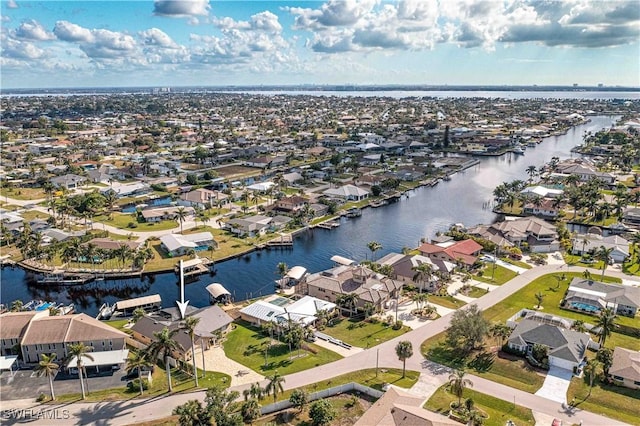 bird's eye view with a water view and a residential view