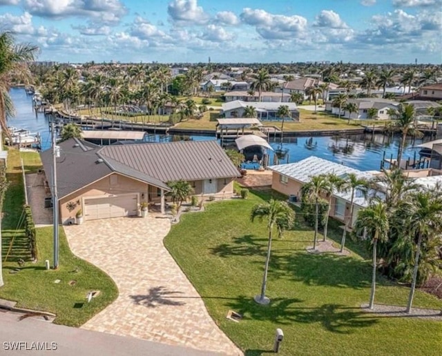 bird's eye view with a water view and a residential view