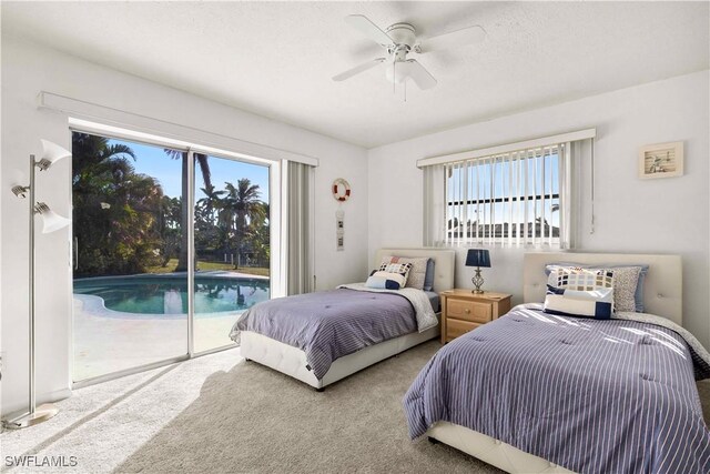 bedroom featuring access to exterior, ceiling fan, and carpet