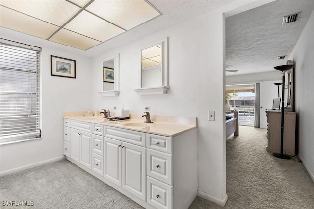 bathroom featuring vanity and a textured ceiling