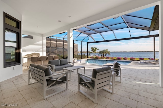 view of patio / terrace featuring outdoor lounge area, a water view, and a lanai