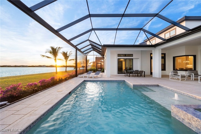 view of swimming pool featuring a patio, a water view, pool water feature, and a lanai