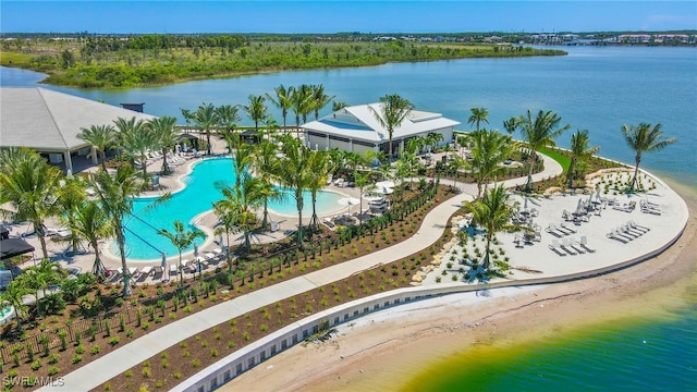 aerial view with a water view and a beach view