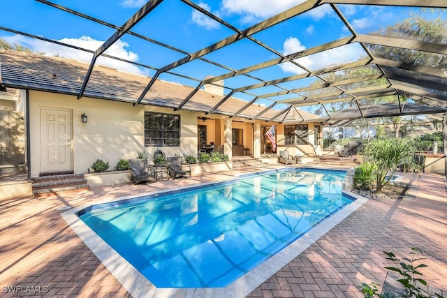 4556 Pond Apple Dr N, Naples, FL 34119 - outdoor pool featuring a patio and a lanai