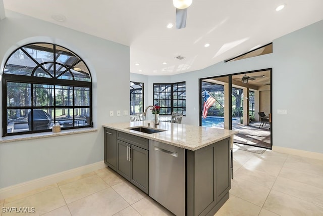 4556 Pond Apple Dr N, Naples, FL 34119 - kitchen featuring dishwasher, a ceiling fan, light stone countertops, vaulted ceiling, and recessed lighting