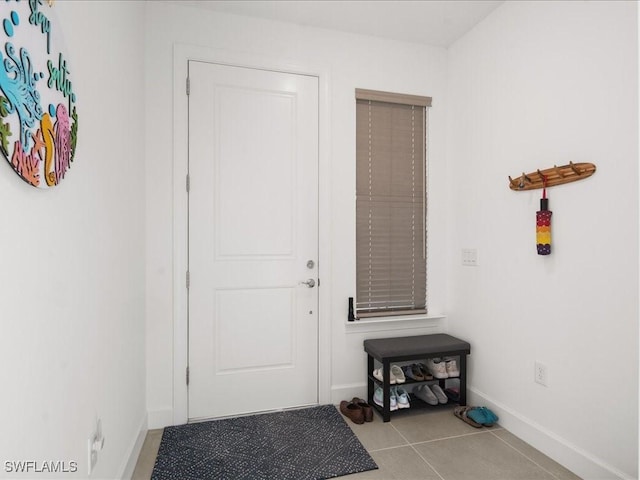 entryway featuring light tile patterned flooring