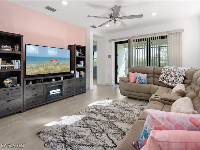 tiled living room featuring ceiling fan