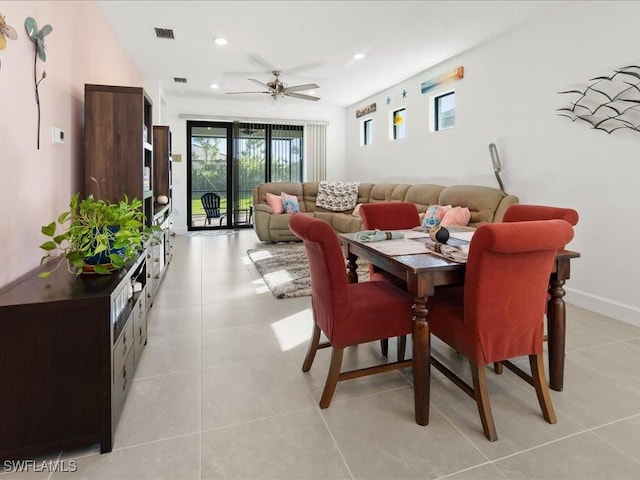 tiled dining room with ceiling fan