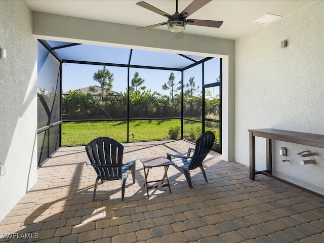 sunroom / solarium with ceiling fan