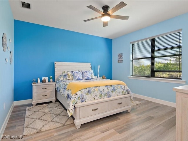 bedroom featuring light hardwood / wood-style floors and ceiling fan