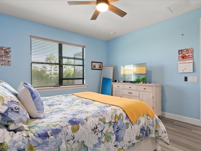 bedroom featuring ceiling fan and light hardwood / wood-style flooring