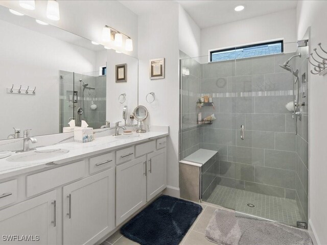 1894 Mesa Ln, Naples, FL 34120 - bathroom with a shower stall, double vanity, and tile patterned flooring