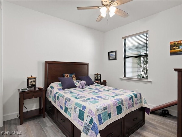 bedroom featuring light wood-type flooring and ceiling fan