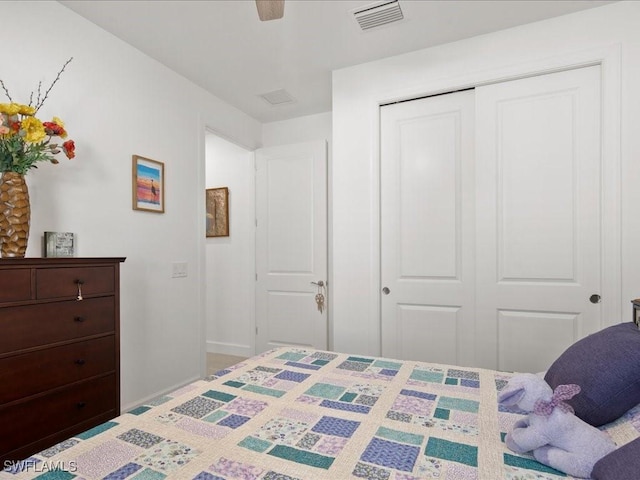 bedroom with ceiling fan and a closet