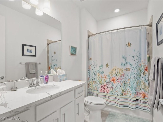 full bathroom featuring tile patterned flooring, shower / bath combination with curtain, vanity, and toilet