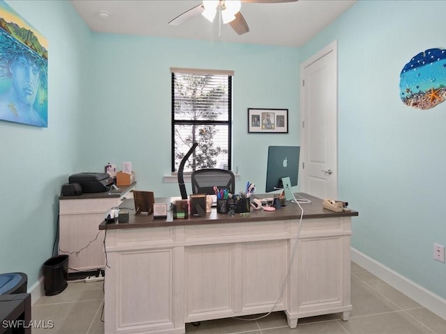 tiled office space featuring ceiling fan