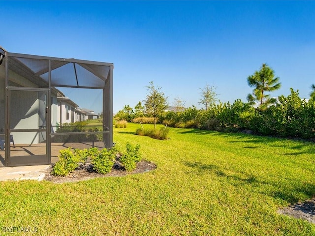 view of yard featuring a lanai