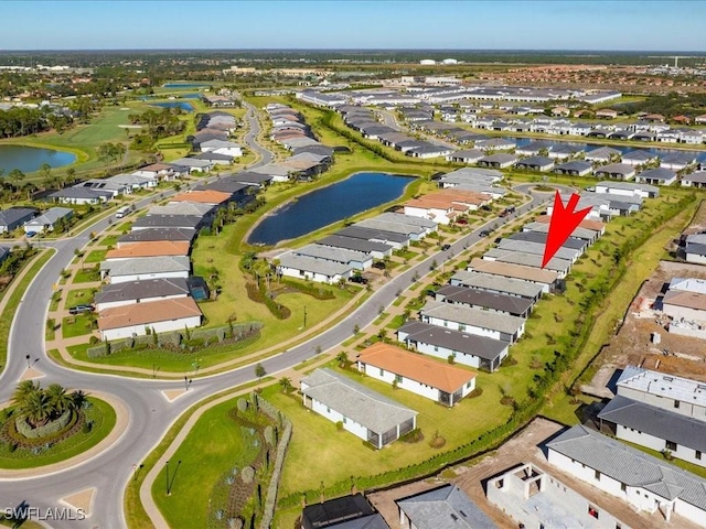 birds eye view of property featuring a water view