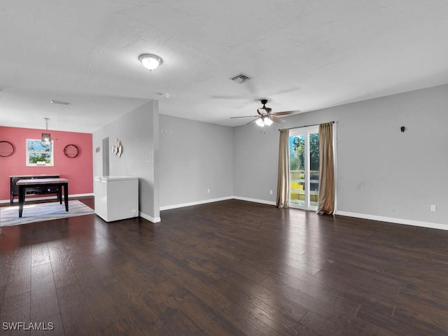 spare room with dark hardwood / wood-style floors and ceiling fan